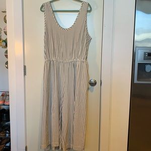 White jumpsuit with black, vertical stripes